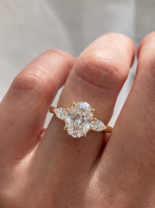 The Juliette Oval Cut Lab-Grown Diamond Three Stone Hidden Halo Engagement Ring