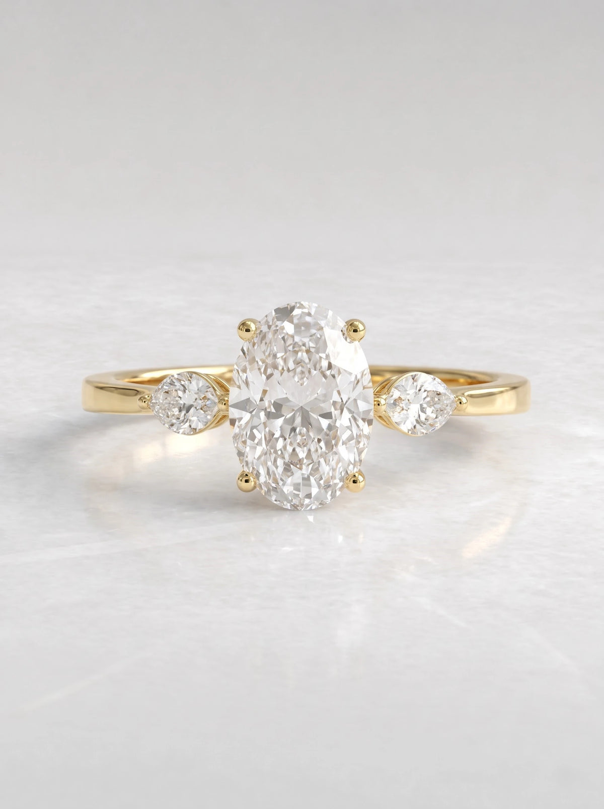 The Juliette Oval Cut Lab-Grown Diamond Three Stone Hidden Halo Engagement Ring - View 2