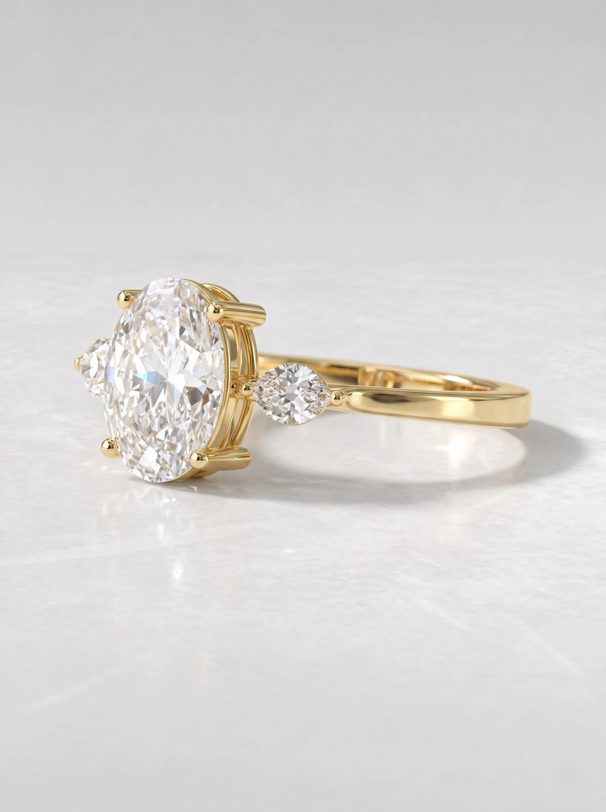 The Juliette Oval Cut Lab-Grown Diamond Three Stone Hidden Halo Engagement Ring - View 3