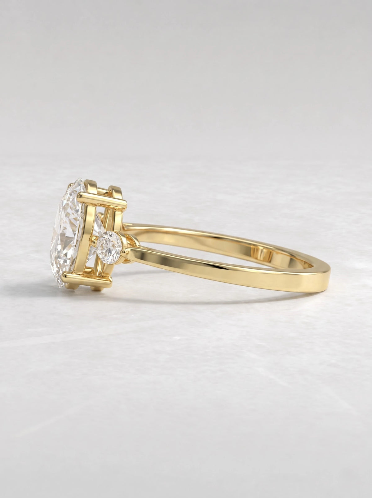 The Juliette Oval Cut Lab-Grown Diamond Three Stone Hidden Halo Engagement Ring - View 4